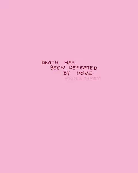 A pink background with handwritten text and the words 'DEATH HAS BEEN DEFEATED BY LOVE.' The text appears in handwritten, dark brown script. Below the text is a small graphic heart.