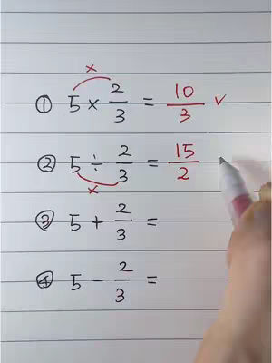 A close-up image shows a white piece of paper with handwritten math problems involving fractions. The paper has blue horizontal lines. A hand with a pen is visible to the right of the paper, partially obscuring the writing. The top-left corner shows a problem solved and checked. The paper has various mathematical expressions handwritten on it.