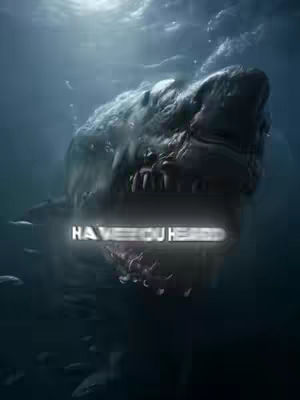 An underwater scene featuring a large shark with its mouth open, positioned in the center and slightly angled upwards. The shark is dark gray, appearing ominous against the darker blue water. The text overlay, 'HAVE YOU HEARD', appears in a glowing white font across the shark's mouth. Smaller fish are visible, adding depth to the scene, and the lighting suggests sunlight filtering down from above.