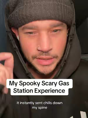 A man wearing a dark beanie and a black hoodie is the focus of the image. A text overlay on the image reads, "My Spooky Scary Gas Station Experience" with additional text below reading "it instantly sent chills down my spine."