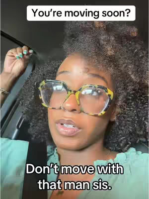 A woman with textured black hair and large, patterned glasses is looking at the camera with a concerned expression while sitting in a car or other vehicle. Text overlays are placed at the top and bottom of the frame.