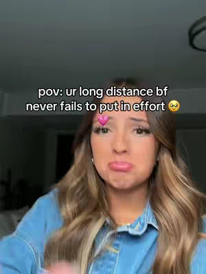 A woman with long, wavy brown hair is shown from the chest up. She's wearing a denim jacket. The text overlay indicates that the content relates to a long-distance boyfriend.