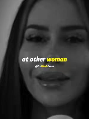 A close-up, black and white shot of a woman's face. She has dark hair and is looking slightly off-camera with a subtle smile. Text overlays the image in white and yellow.