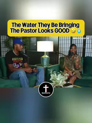 The cover image shows two people, a man and a woman, seated on green sofas in what appears to be a studio setting. The text overlay in a yellow banner reads, 'The Water They Be Bringing The Pastor Looks GOOD' with laughing and water drop emojis. The background includes a white decorative screen and a table supporting a lamp. The foreground includes some plants. The overall composition suggests a podcast or interview style video.