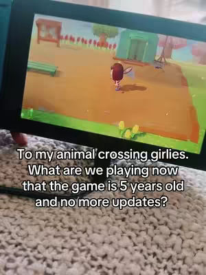 The cover image shows a Nintendo Switch screen displaying a game that looks like Animal Crossing. On the screen, a player character with short dark hair and a red shirt is walking on a dirt path with a net. There is a building and a tent. In the foreground is a gray carpet, and the game console is held. At the bottom of the image, it shows the video's title.