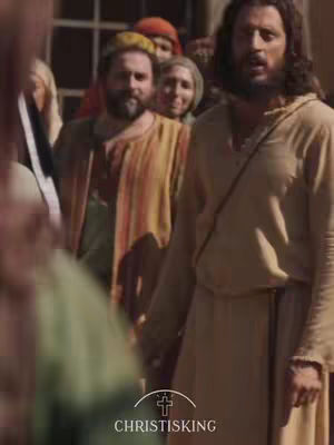 The cover image shows a scene from a film featuring several individuals in period clothing. The main figure is a man with long dark hair and a beard, dressed in a light tan robe. Near the center, several other people are visible, including a man with a yellow head covering and a woman with light-colored hair. The setting appears to be outdoors, with soft lighting and a crowd in the background. The text overlay at the bottom reads "CHRISTISKING" with a cross symbol.