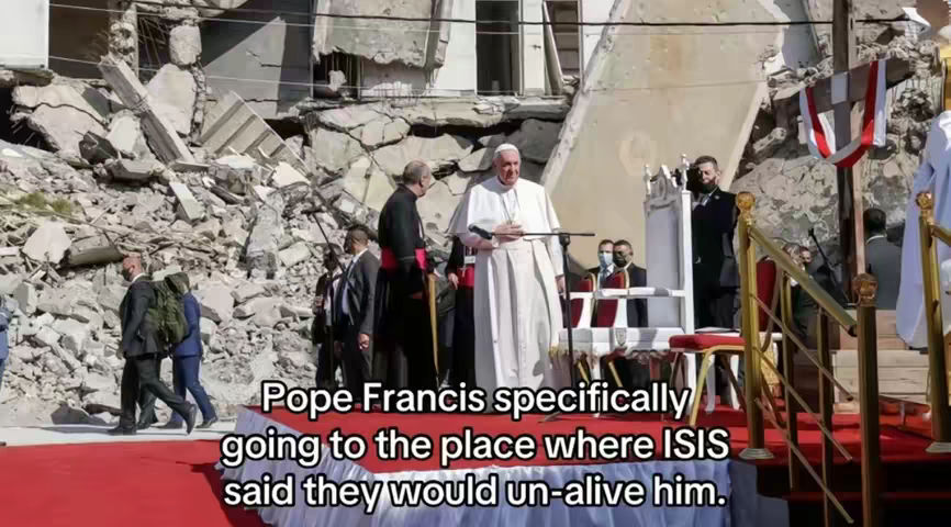 The image shows Pope Francis standing on a red carpet, with a backdrop of a building that has partially collapsed. Other people are present, including individuals in suits and religious attire, suggesting a formal and potentially solemn event. Text overlays are added to the image.