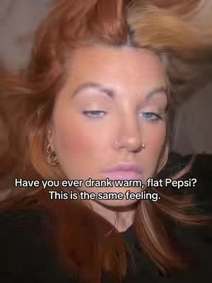 The cover image features a close-up of a woman's face from a tilted perspective, emphasizing her expression. She has light skin, with visible makeup including blush and lip color. Her hair is a mix of reddish-brown and blonde, with a visible side part. She is looking slightly down and to her left, and resting the side of her face, the expression appears melancholic. Overlayed text gives context, suggesting a feeling of disappointment.