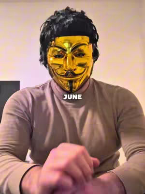 The cover image shows a person wearing a gold Guy Fawkes mask, with a black wig. The person is looking at the camera, arms bent with hands clasped. The mask covers the person’s face. The word "JUNE" is written in a white box centered below the mask.