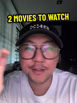 The cover image features a man in a close-up shot. He is wearing glasses, a black cap, and a white t-shirt. The text overlay at the top, in a yellow background, reads "2 MOVIES TO WATCH". The background is dark.