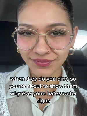A woman with glasses and a subtle smile is the focus. Text is overlaid towards the bottom, providing context for the video's topic.