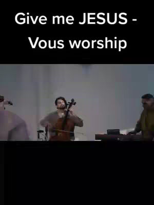 The cover image features a musical performance with a person playing a cello in the foreground, a keyboard player to the right, and a blurred background.