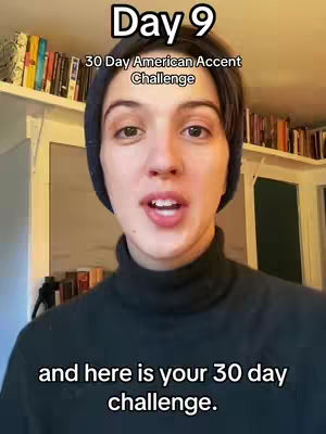 A young woman with fair skin, wearing a dark blue beanie and a black turtleneck, looks directly at the camera with an open mouth. Above her head at the top of the image are the words 'Day 9'. Below, in a lighter font, are the words '30 Day American Accent Challenge'. At the bottom of the image is the caption 'and here is your 30 day challenge.'