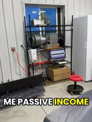 The image shows a garage or industrial setting with a rack holding computer equipment and a sign that says "ME PASSIVE INCOME". The room has a window in the background and electrical components.