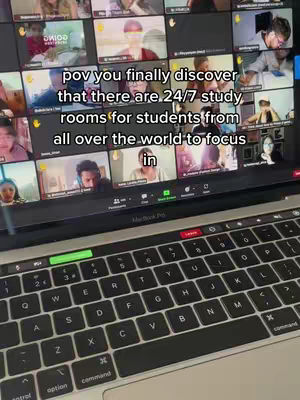 A laptop screen displaying a Zoom meeting. Multiple video feeds of students studying are visible. Overlay text at the top reads 'pov you finally discover that there are 24/7 study rooms for students from all over the world to focus in.' Below the screen is a laptop keyboard.
