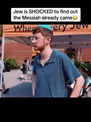 A man wearing glasses and a yarmulke stands in front of a banner. The text overlay says 'Jew is SHOCKED to find out the Messiah already came'.