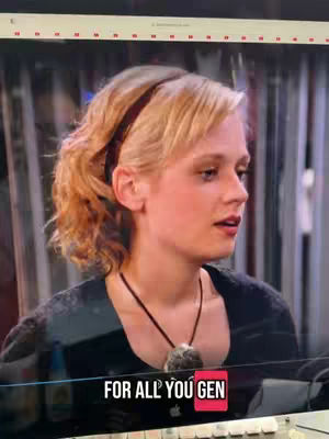 The image shows a woman in a black shirt with her hair pulled back, a dark headband, and a necklace with a large pendant. Text in a red box at the bottom of the screen says "FOR ALL YOU GEN".