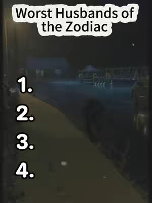 The cover image shows a dark, slightly blurry outdoor scene at dusk or night. The focus is on text overlayed in white, centered at the top 'Worst Husbands of the Zodiac,' with four numbered bullet points below. The background is a street scene with buildings and ambient lighting. The overall tone is mysterious or intriguing.