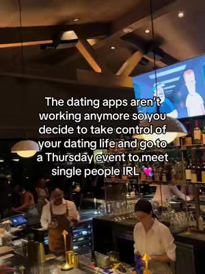 The cover photo is taken inside of what appears to be a bar or restaurant, featuring a bartender behind a counter. Text in a white font overlays the image, offering commentary on dating apps and promoting events to meet single people in person. The ambiance includes hanging lights and a TV screen, implying a social environment. There are people in the background at tables.