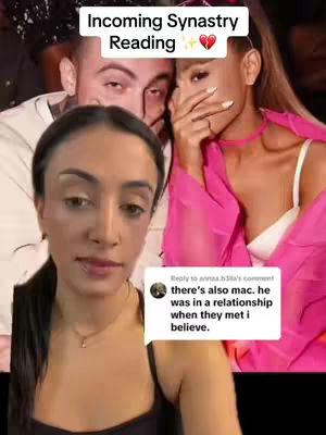 A selfie-style video showing a woman in the foreground, with two overlaid images of a man and woman in the background. The woman in the foreground is looking at the camera with a neutral expression and is holding her hand near her mouth. The background features a couple possibly Ariana Grande and Mac Miller from a previous photo, with text overlays like 'Incoming Synastry Reading'. A comment in a speech bubble adds context.