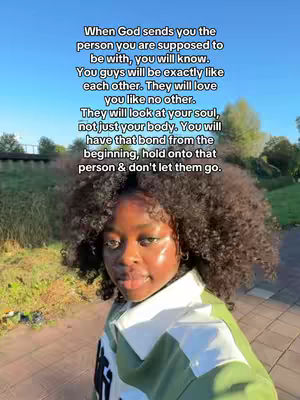 A young Black woman with curly hair is looking at the camera. Overlayed on the image is white text. The background is a parklike setting.