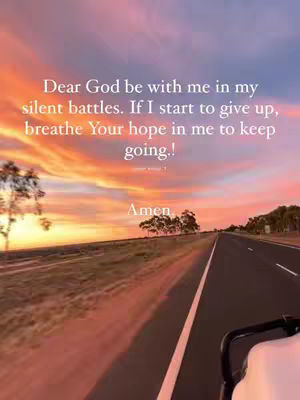 A scenic view of a road through a landscape with a colorful sunset and text overlayed. The sky is filled with gradients of orange, pink, and purple, suggesting either a sunrise or sunset. The road leads directly towards the horizon, flanked by fields and sparse trees. A portion of a vehicle is visible on the right side, implying the shot is from a moving car.