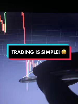 The image features a close-up of a computer screen displaying a stock chart. A hand holding a pen is partially visible, seemingly drawing on the chart, with text overlay. Colors include deep blue, red, and green.