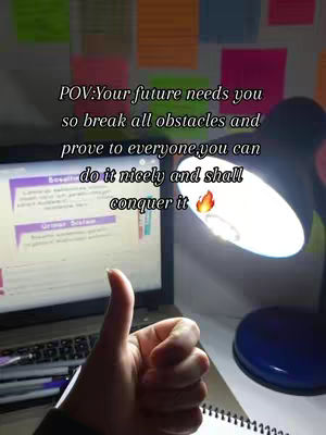 The image shows a hand giving a thumbs-up in front of a laptop and a desk lamp. The scene is lit from the lamp, which creates a warm glow. The background is filled with colorful sticky notes, and a handwritten message is overlaid on top of the scene in white letters, as if to represent an internal monologue.