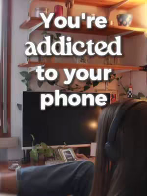 The image shows a person sitting with their back to the camera, wearing headphones. The person is in front of a dark screen, likely a television. The background includes wooden shelves with various objects, and the upper portion of the image contains text overlayed on the scene.