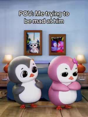 A cartoon image shows two penguin figures, one gray with a bow and the other pink with a bow, in a bedroom setting. The penguins have large eyes and are positioned in front of a bed with two framed pictures and lamps behind them. The text overlayed on the image says, 'POV: Me trying to be mad at him.'