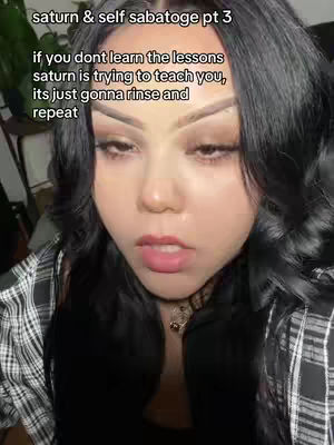 A close-up shot of a woman with dark hair and makeup looking directly into the camera. Text overlays appear at the top of the image.