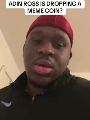 A man in a black jacket and a red beanie is looking at the camera and speaking. Above him is text on a white background.