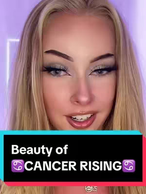 A close-up shot of a woman with blonde hair and full makeup, the text overlay in the black rectangular bar at the bottom says "Beauty of CANCER RISING".