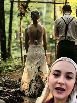 The cover image shows a bride from the back at what appears to be a blurred outdoor wedding. The bride has her back to the camera and is wearing a white dress, which is covered in dirt or mud at the hem. Part of the wedding party can be seen in the background. In a corner of the image, there's a face of a woman who is talking to the camera with her blonde hair being flipped.