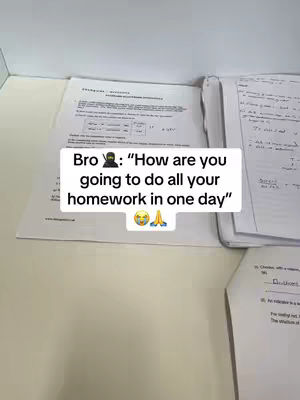 The image shows a workspace with open textbooks and papers on a light-colored surface. A text overlay in a white box with a black border is placed over the materials, posing a question over the homework completion.