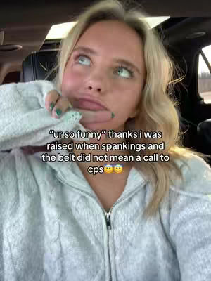 A young woman with blonde hair looks up and to the side with a pondering expression. She appears to be in a car as the background is unclear but appears to be a driving area. Written text overlays her upper body.