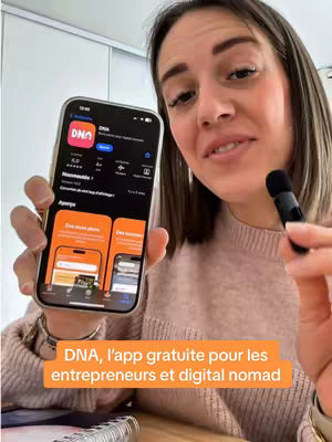 A woman holds a smartphone displaying the app's interface, including its logo and a preview of the app's features. She is positioned in front of a softly lit background.