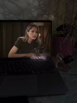The cover image shows a woman sitting in front of a laptop. The laptop screen displays the woman as well, appearing as if she is recording a video or podcast. The word "choose" is overlaid on the lower part of the screen.