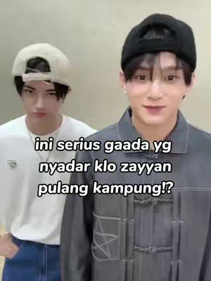 The cover image features two young men. One, in the foreground, is smiling wearing a black beanie and grey jacket over a white t-shirt. The other man, slightly behind and to the left, wears a white cap and looks towards the foreground with a slightly stern expression. White text is laid over the image, and the background is a neutral tone.