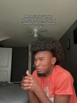 A man with a short dark haircut and a goatee poses with his hands clasped near his mouth in a room, with overhead text indicating a video about Easter Sunday with Christian humor.