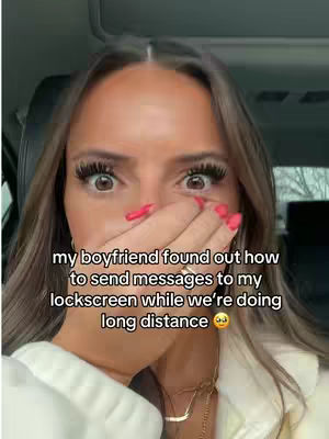 A selfie featuring a fair-skinned woman with long brown hair, covering her mouth with her hand. She has large, expressive eyes and striking red nail polish. Text overlays the image, communicating a personal story, over a blurred background.