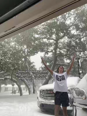 A person stands with arms outstretched, framed against a snow-covered backdrop of trees and partially snow-covered vehicles. Text across the image references proof of God's abilities.