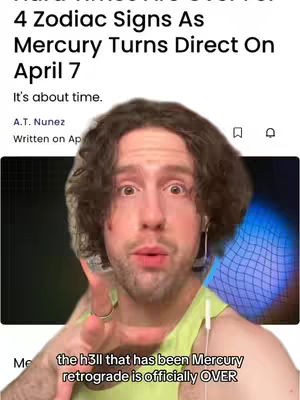A man with curly brown hair and a light complexion is centered in the frame. He is wearing a light green tank top, and has an earring in his left ear. His eyes are wide, and he appears to be talking, with one hand raised and fingers extended.