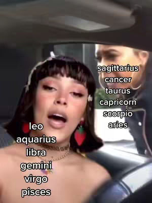 A woman with dark hair and makeup is in the foreground of a car, appearing to be speaking. Text overlays list zodiac signs.