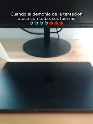 The cover image shows a computer setup with a closed laptop, a monitor, and a wooden desk. Above the monitor, text is overlaid. The composition is simple, with focus on the tech and text elements.