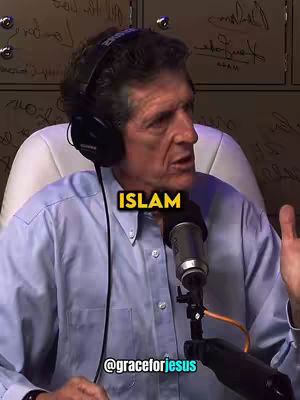 A man in a light blue button-down shirt is speaking into a microphone. The word 'ISLAM' is overlaid on the image in a yellow box, and a username is below the overlay.