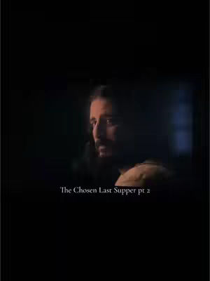The image is a still from the show "The Chosen." It is very dark, with the primary visual element being a man's face in profile against a dark background. The face appears to be in the shadows, with light catching his profile. The color palette is muted, consisting mainly of blacks and browns. Towards the bottom is the text overlay that says "The Chosen Last Supper pt 2".