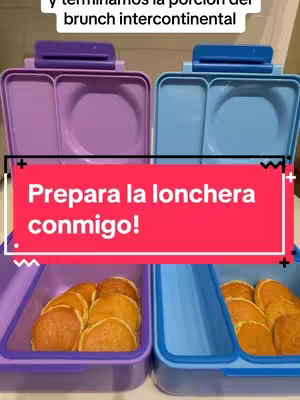 Two open lunchboxes, one purple and one blue, filled with mini pancakes. A red bar with white text is overlaid on the image.