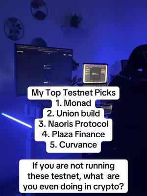 A dimly lit room with a person's desk and setup is shown. A monitor and a laptop are present on the desk. The cover image has added text with a list of testnet picks with the top 5 testnet picks and a question asking 'If you are not running these testnet, what are you even doing in crypto?'