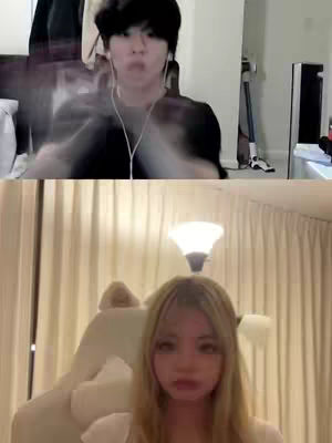The cover image is split horizontally, featuring two individuals. The top half shows a person with dark hair, wearing a black top, and appearing to be in front of a camera; they are facing the camera with an expression. The bottom half shows a person with blonde hair seated indoors with a light-colored room.